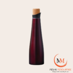 Meraki CorkForm deep burgundy sculptural vacuum insulated bottle with natural cork stopper